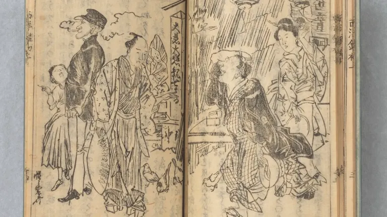 Hands holding an open manga volume, showing how to read manga right to left